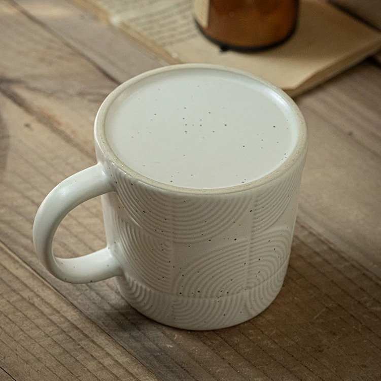 Minimalist Ceramic Mug with Subtle Relief Texture product view